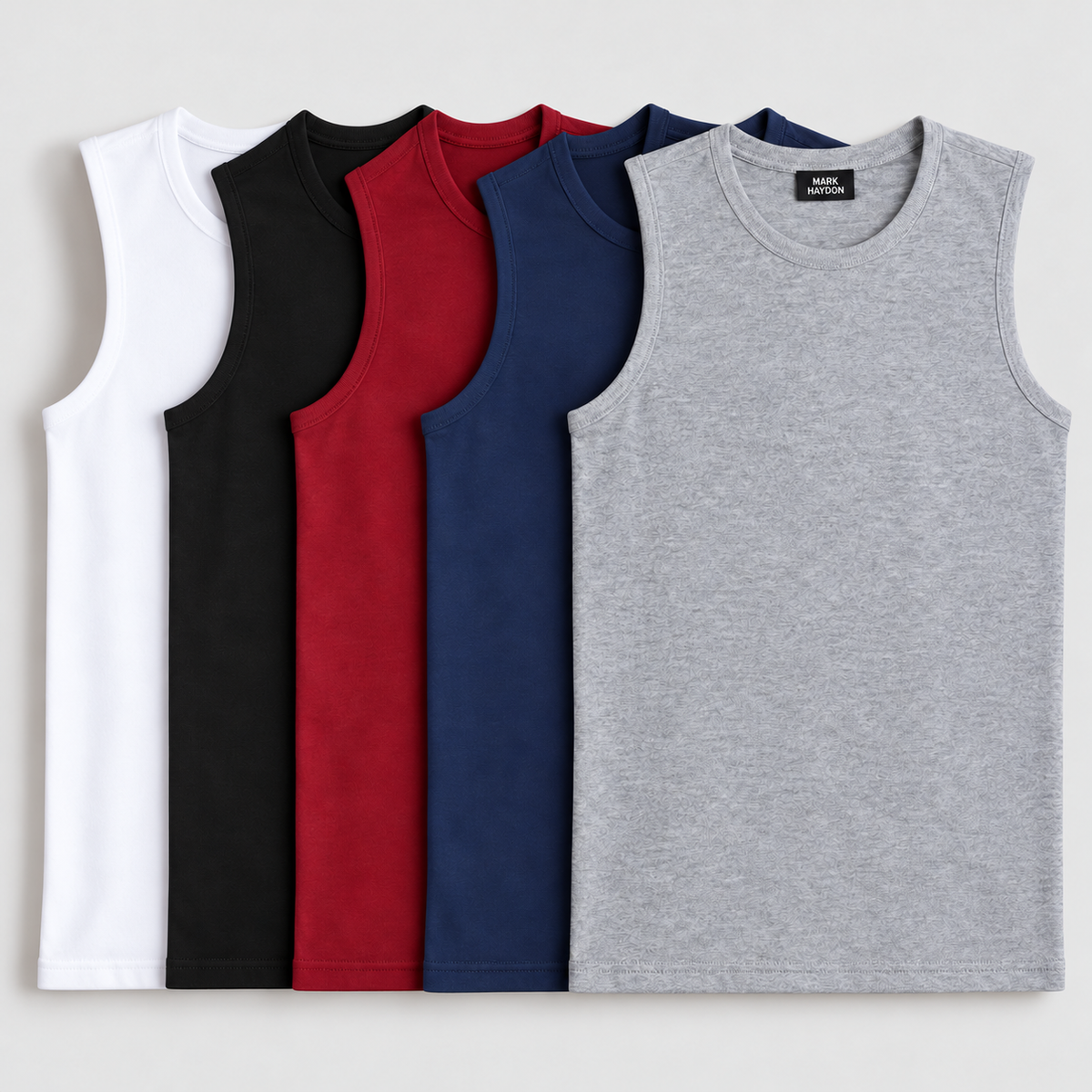 Five MARK HAYDON sandos in white, black, maroon, navy blue and grey with branding visible on the front grey sando